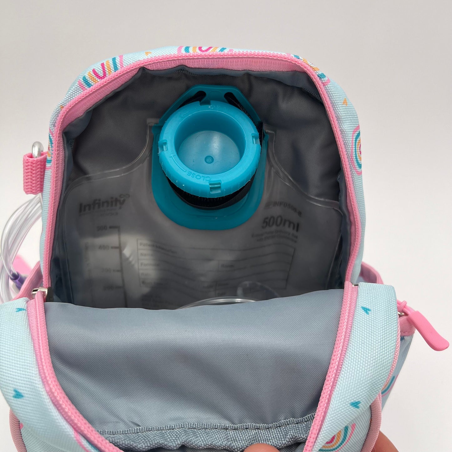 Infant Sized Tube Feeding Backpack with Leash | 500ML | for EnteraLite Infinity Pump | XS 9.5” | Blue and Pink Rainbows